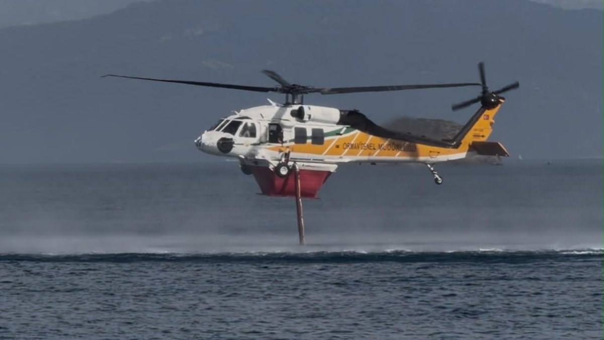 Muğla’daki orman yangınına havadan yoğun müdahale: Helikopterler peş peşe su attı